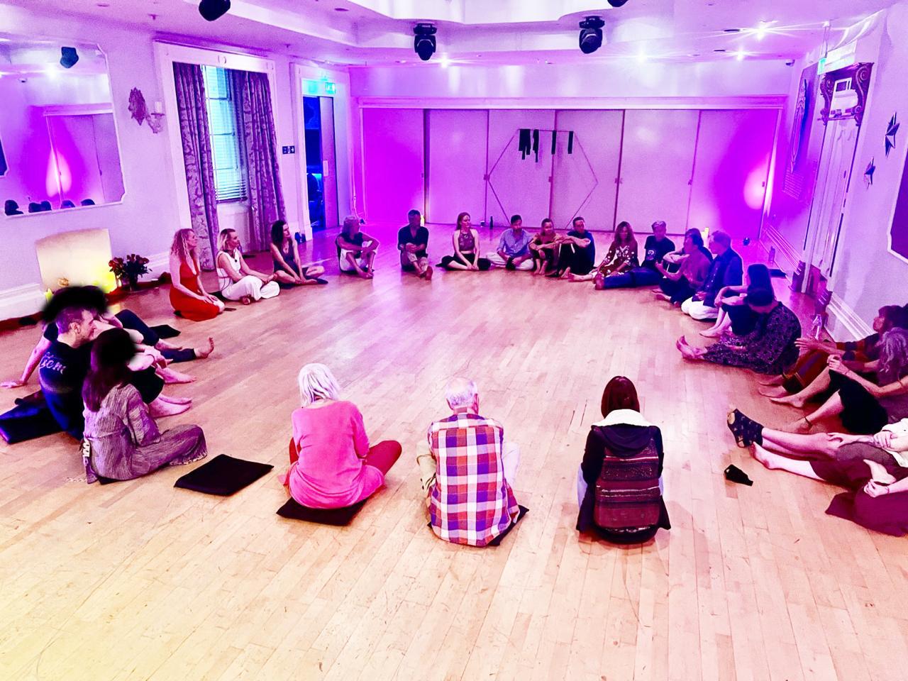 Participants seated together in a large welcoming circle at our 2025 Devon gathering